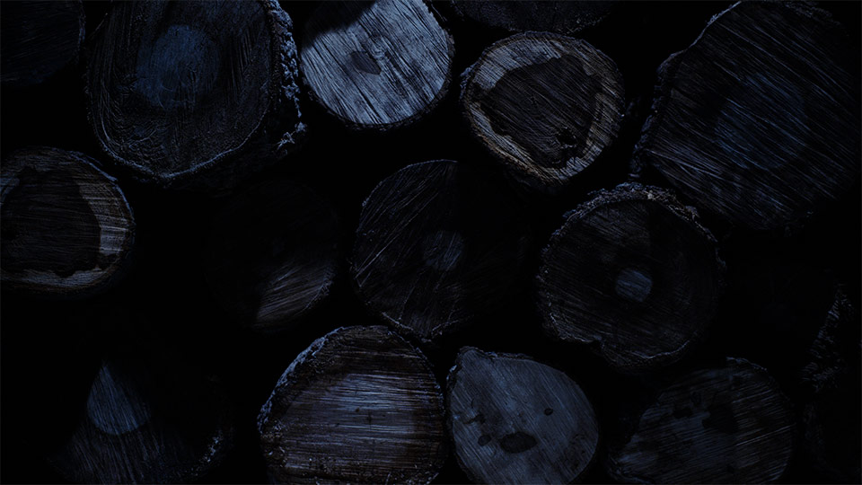An abstract shot fo wood stacked up sitting in moonlight.