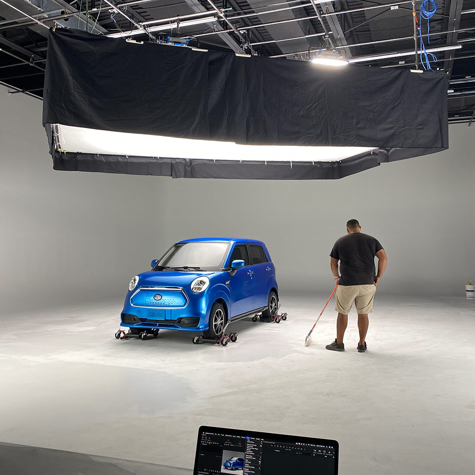 A behind the scenes shot of a Kandi car commercial.