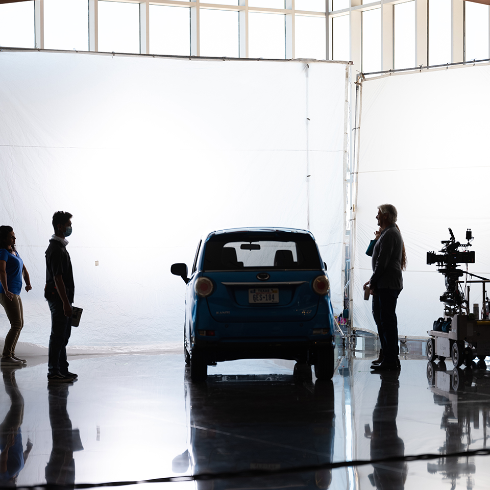 A behind the scenes shot of a Kandi car commercial.