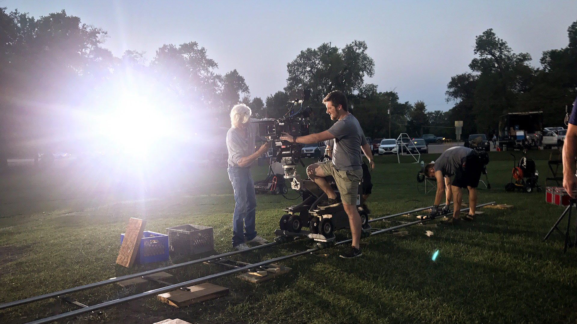 A behind-the-scenes shot of a camera on a dolly being used to film a commercial.