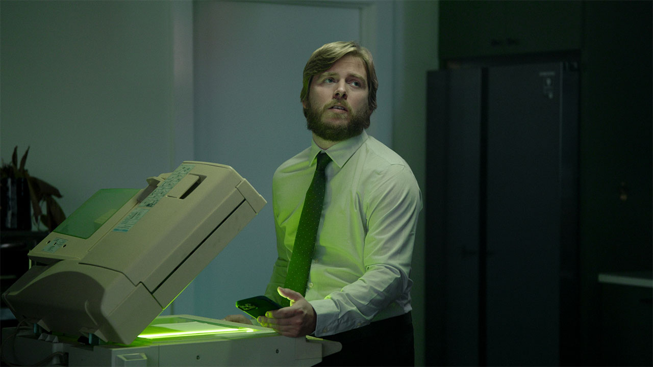 A man using a photocopier.